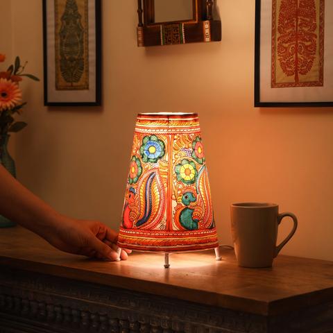 Handpainted Tholu Bommalata Leather Table Lamp (Medium), lit in a home in the evening, AI visual of the light, iTokri