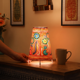 Handpainted Tholu Bommalata Leather Table Lamp (Medium), lit in a home in the evening, AI visual of the light, iTokri
