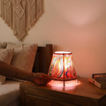 Handpainted Tholu Bommalata Leather Table Lamp (Small), lit in a home in the evening, AI visual of the light, iTokri