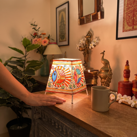 Handpainted Tholu Bommalata Leather Table Lamp (Small), lit in a home in the evening, AI visual of the light, iTokri