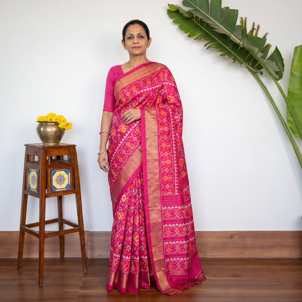 Pink Handspun Handloom Silk Pochampally Patola Ikat Saree with Zari Border, draped and worn by a woman, AI visual of the saree, iTokri