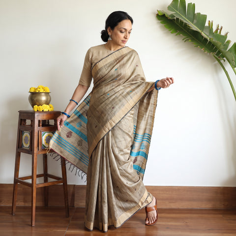 Beige Handspun Handwoven Bhagalpuri Desi Tussar Silk Saree, draped and worn by a woman, AI visual of the saree, iTokri