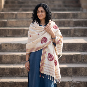 White Handspun Handwoven Pure Eri Silk Aari Hand Embroidered Shawl of Assam, worn by a model, AI visual of the shawl, iTokri