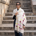 White Handspun Handwoven Pure Eri Silk Aari Hand Embroidered Shawl of Assam, worn by a model, AI visual of the shawl, iTokri