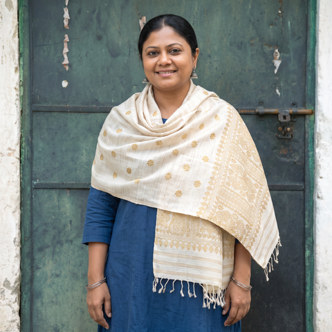 White Handspun Handwoven Pure Eri Silk Aari Hand Embroidered Shawl of Assam, worn by a model, AI visual of the shawl, iTokri