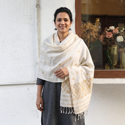 White Handspun Handwoven Pure Eri Silk Aari Hand Embroidered Shawl of Assam, worn by a model, AI visual of the shawl, iTokri