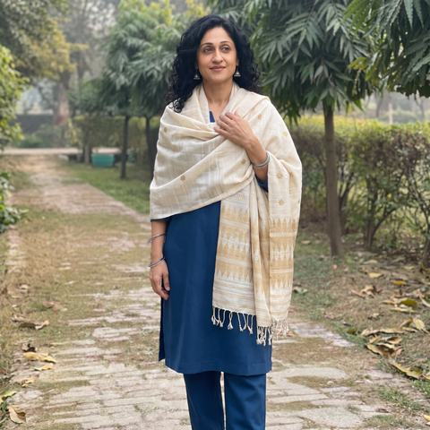 White Handspun Handwoven Pure Eri Silk Aari Hand Embroidered Shawl of Assam, worn by a model, AI visual of the shawl, iTokri