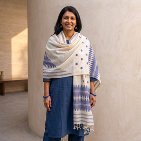 White Handspun Handwoven Pure Eri Silk Aari Hand Embroidered Shawl of Assam, worn by a model, AI visual of the shawl, iTokri