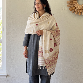 White Handspun Handwoven Pure Eri Silk Aari Hand Embroidered Shawl of Assam, worn by a model, AI visual of the shawl, iTokri