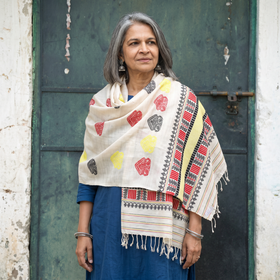 White Handspun Handwoven Pure Eri Silk Aari Hand Embroidered Shawl of Assam, worn by a model, AI visual of the shawl, iTokri
