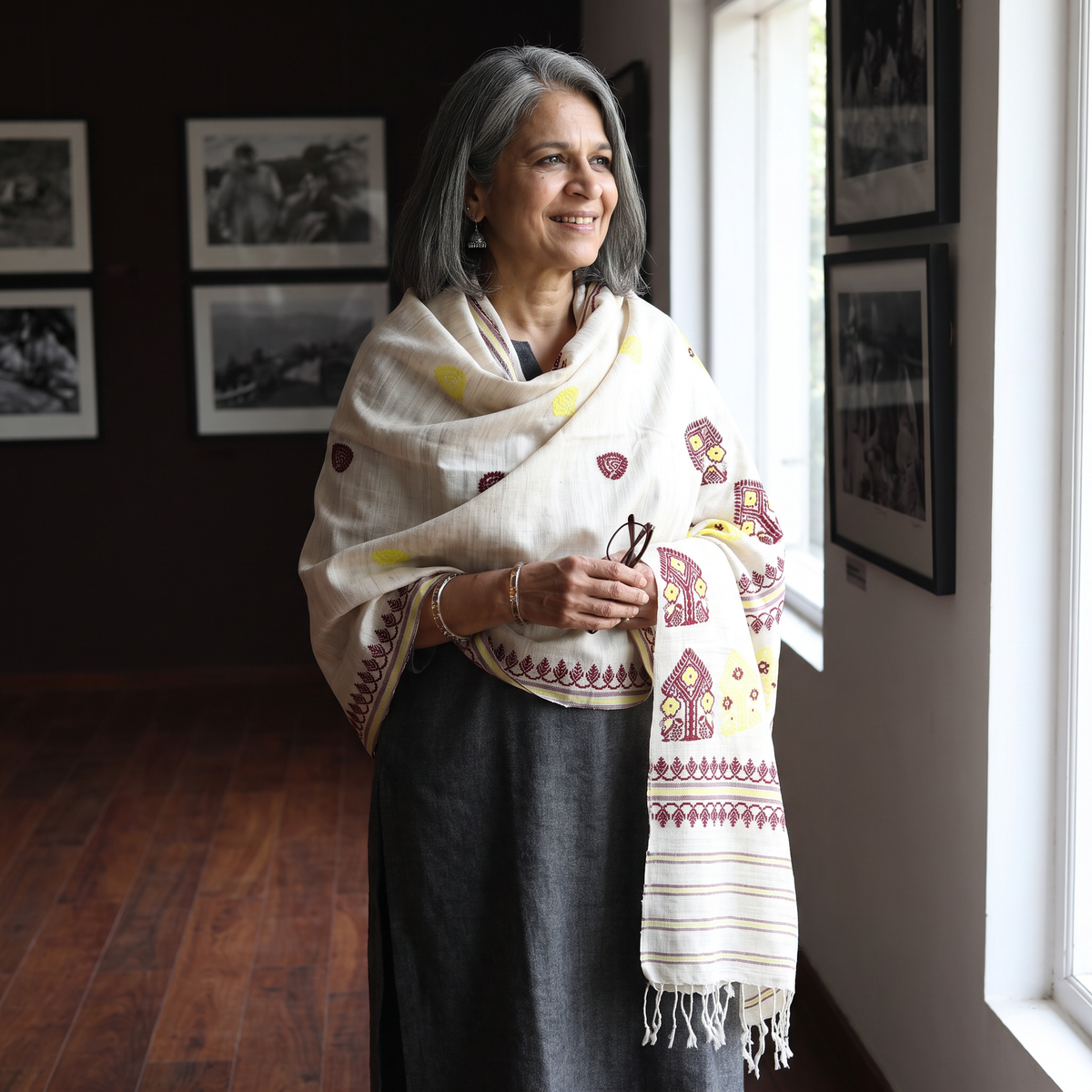 White Handspun Handwoven Pure Eri Silk Aari Hand Embroidered Shawl of Assam, worn by a model, AI visual of the shawl, iTokri
