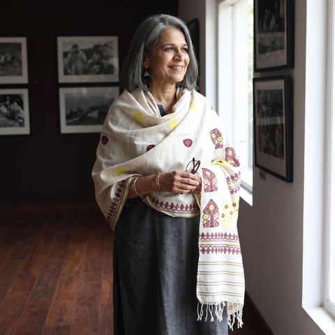 White Handspun Handwoven Pure Eri Silk Aari Hand Embroidered Shawl of Assam, worn by a model, AI visual of the shawl, iTokri