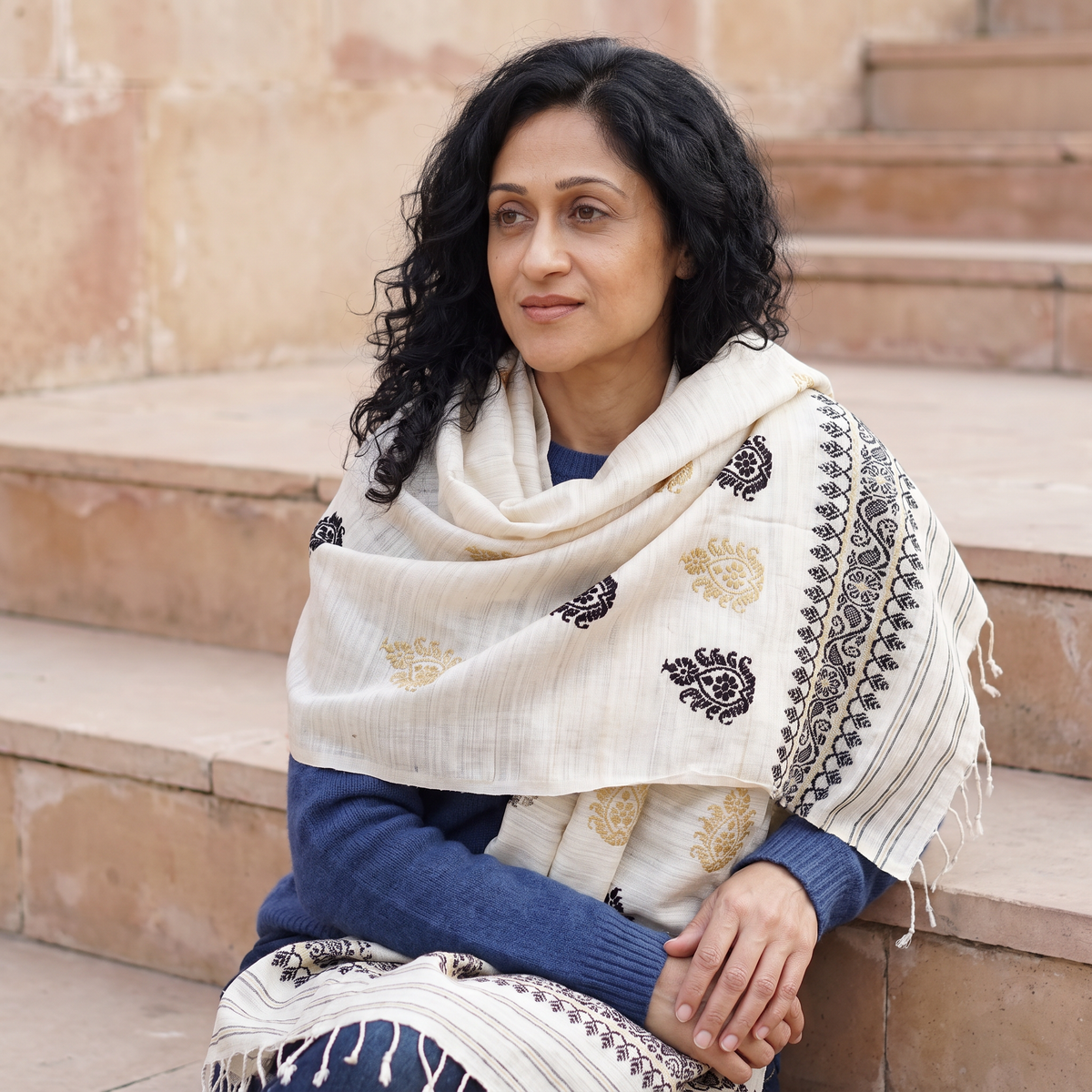 White Handspun Handwoven Pure Eri Silk Aari Hand Embroidered Shawl of Assam, worn by a model, AI visual of the shawl, iTokri