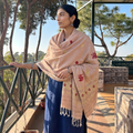 Peach Handspun Handwoven Pure Eri Silk Aari Hand Embroidered Shawl of Assam, worn by a model, AI visual of the shawl, iTokri