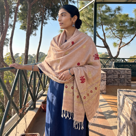 Peach Handspun Handwoven Pure Eri Silk Aari Hand Embroidered Shawl of Assam, worn by a model, AI visual of the shawl, iTokri