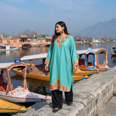 Blue Handwoven Aari Embroidered Kashmiri Merino Wool Pheran, worn by a model, AI visual of the pheran, iTokri