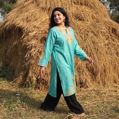 Blue Handwoven Aari Embroidered Kashmiri Merino Wool Pheran, worn by a model, AI visual of the pheran, iTokri