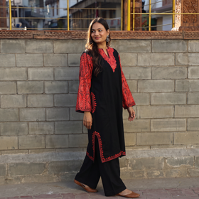 Black Handwoven Aari Embroidered Kashmiri Merino Wool Pheran, worn by a model, AI visual of the pheran, iTokri