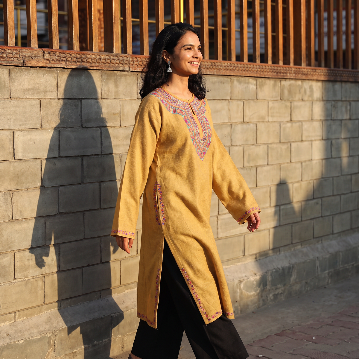 Yellow Handwoven Aari Hand Embroidered Kashmiri Merino Wool Pheran, worn by a model, AI visual of the pheran, iTokri
