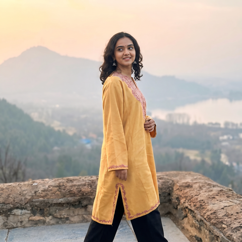 Yellow Handwoven Aari Hand Embroidered Kashmiri Merino Wool Pheran, worn by a model, AI visual of the pheran, iTokri