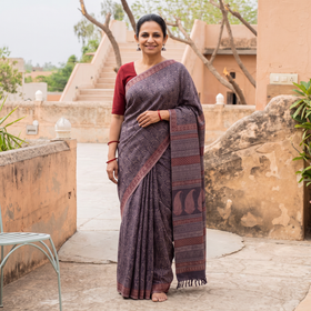 Purple Handwoven Merino Wool Natural Dyed Hand Block Bagh Print Saree, draped and worn by a woman, AI visual of the saree, iTokri