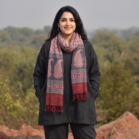 Grey and red Handwoven Merino Wool Natural Dyed Hand Block Bagh Print Stole, worn by a woman, AI visual of the stole, iTokri