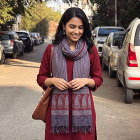 Grey and red Handwoven Merino Wool Natural Dyed Hand Block Bagh Print Stole, worn by a woman, AI visual of the stole, iTokri