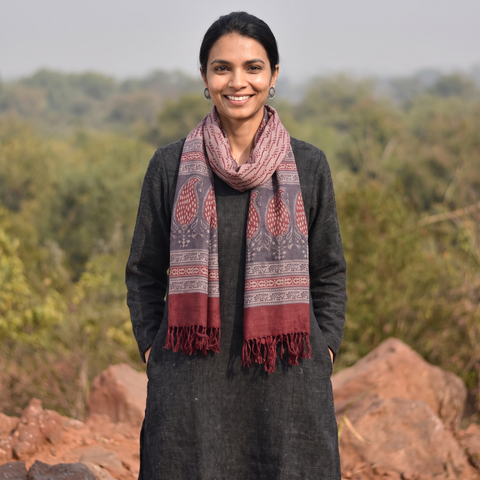 Grey and red Handwoven Merino Wool Natural Dyed Hand Block Bagh Print Stole, worn by a woman, AI visual of the stole, iTokri