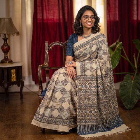 Beige Handwoven Merino Wool Natural Dyed Hand Block Print Ajrakh Saree, draped and worn by a woman, AI visual of the saree, iTokri