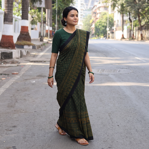 Green Handwoven Merino Wool Natural Dyed Hand Block Print Ajrakh Saree, draped and worn by a woman, AI visual of the saree, iTokri