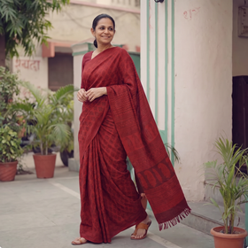 Red Handwoven Merino Wool Natural Dyed Hand Block Print Bagh Saree, draped and worn by a woman, AI visual of the saree, iTokri