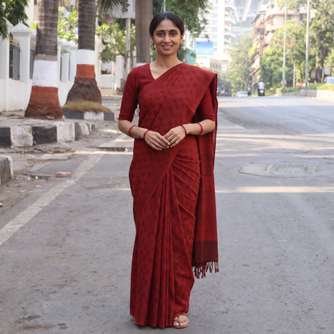 Red Handwoven Merino Wool Natural Dyed Hand Block Print Bagh Saree, draped and worn by a woman, AI visual of the saree, iTokri