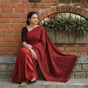 Red Handwoven Merino Wool Natural Dyed Hand Block Print Bagh Saree, draped and worn by a woman, AI visual of the saree, iTokri