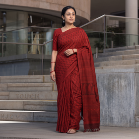 Red Handwoven Merino Wool Natural Dyed Hand Block Print Bagh Saree, draped and worn by a woman, AI visual of the saree, iTokri