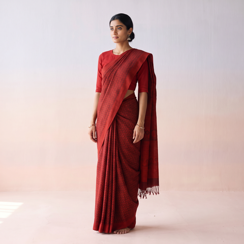 Red Handwoven Merino Wool Natural Dyed Hand Block Print Bagh Saree, draped and worn by a woman, AI visual of the saree, iTokri