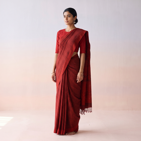 Red Handwoven Merino Wool Natural Dyed Hand Block Print Bagh Saree, draped and worn by a woman, AI visual of the saree, iTokri