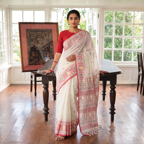 White Handwoven Pure Cotton Phulia Jamdani Saree for Durga Puja, draped and worn by a woman, AI visual of the saree, iTokri