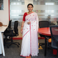 White Handwoven Pure Cotton Phulia Jamdani Saree for Durga Puja, draped and worn by a woman, AI visual of the saree, iTokri