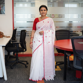White Handwoven Pure Cotton Phulia Jamdani Saree for Durga Puja, draped and worn by a woman, AI visual of the saree, iTokri