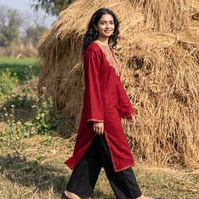 Red Handwoven Sozni Hand Embroidered Kashmiri Merino Wool Pheran, worn by a model, AI visual of the pheran, iTokri