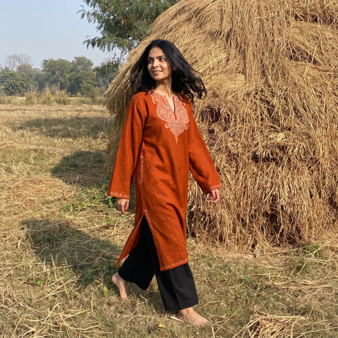 Red Handwoven Sozni Hand Embroidered Kashmiri Merino Wool Pheran, worn by a model, AI visual of the pheran, iTokri