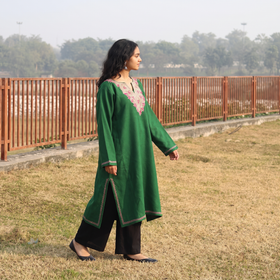 Green Handwoven Sozni Hand Embroidered Kashmiri Merino Wool Pheran, worn by a model, AI visual of the pheran, iTokri