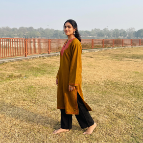 Brown Handwoven Sozni Hand Embroidered Kashmiri Merino Wool Pheran, worn by a model, AI visual of the pheran, iTokri