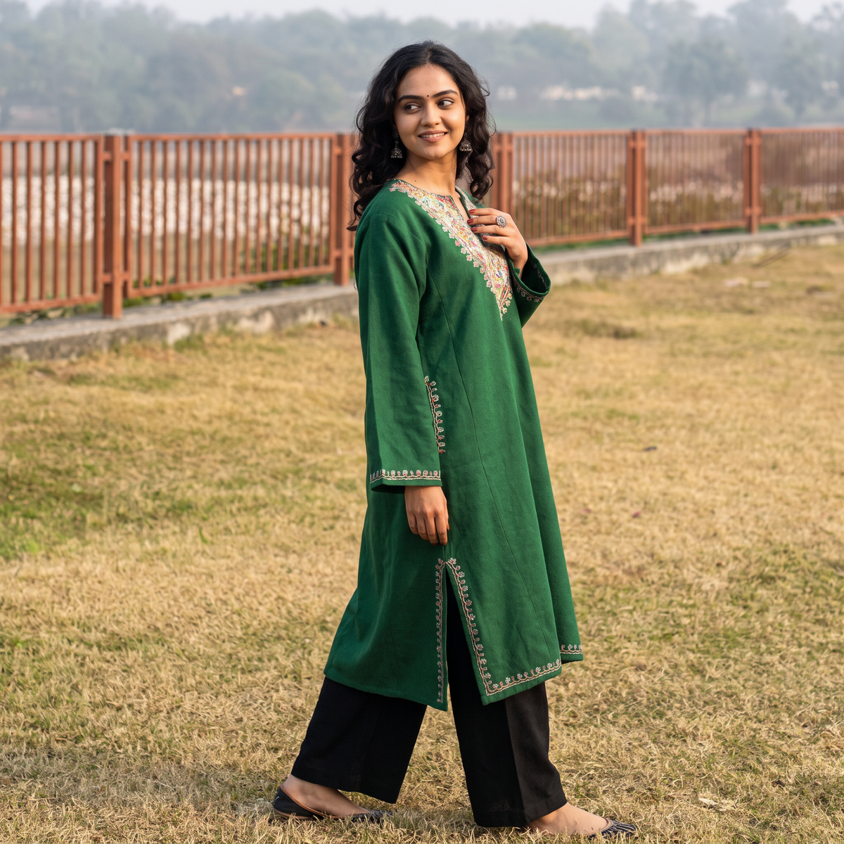 Green Handwoven Sozni Hand Embroidered Kashmiri Merino Wool Pheran, worn by a model, AI visual of the pheran, iTokri