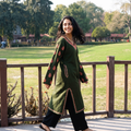 Green Handwoven Sozni Hand Embroidered Kashmiri Merino Wool Pheran, worn by a model, AI visual of the pheran, iTokri