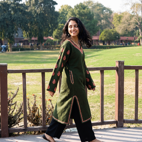 Green Handwoven Sozni Hand Embroidered Kashmiri Merino Wool Pheran, worn by a model, AI visual of the pheran, iTokri