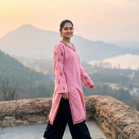 Pink Handwoven Sozni Hand Embroidered Kashmiri Merino Wool Pheran, worn by a model, AI visual of the pheran, iTokri