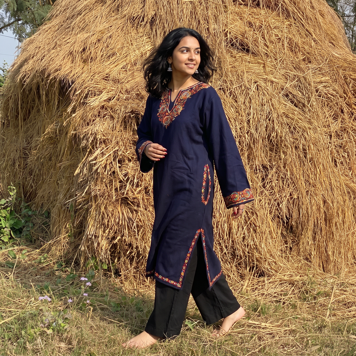 Blue Handwoven Sozni Hand Embroidered Kashmiri Merino Wool Pheran, worn by a model, AI visual of the pheran, iTokri