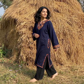 Blue Handwoven Sozni Hand Embroidered Kashmiri Merino Wool Pheran, worn by a model, AI visual of the pheran, iTokri
