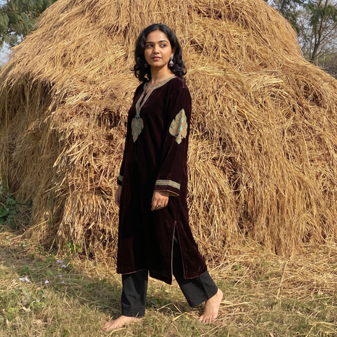 Maroon Handwoven Sozni Hand Embroidered Kashmiri Velvet Pheran, worn by a model, AI visual of the pheran, iTokri